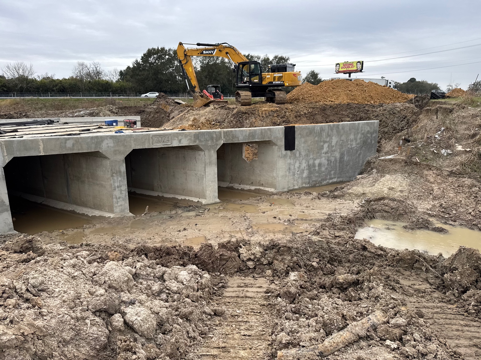 TLP box culvert installation with a large excavator on site